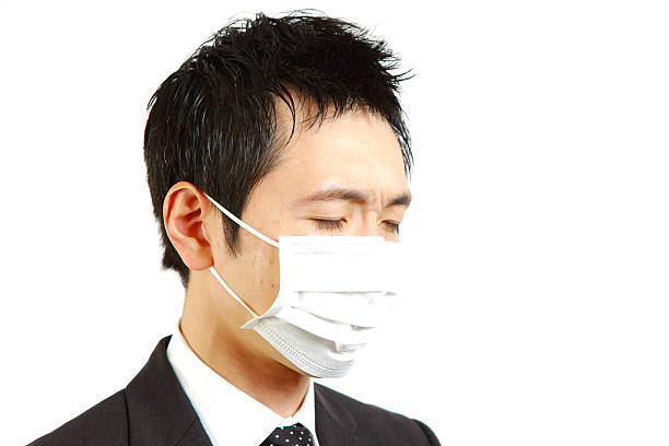 istock Japanese businessman with mask 499059723