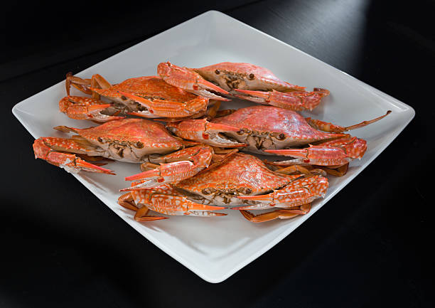 istock Close-up steamed crabs on black background 499060102