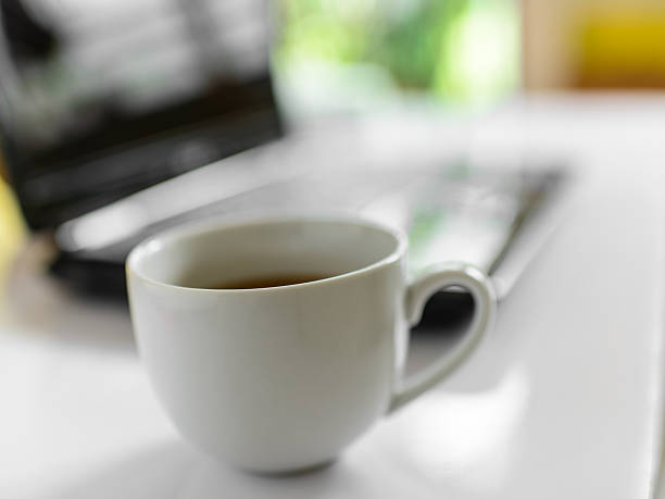 istock Coffee cup and laptop for business, Selective focus on coffee. 499060985