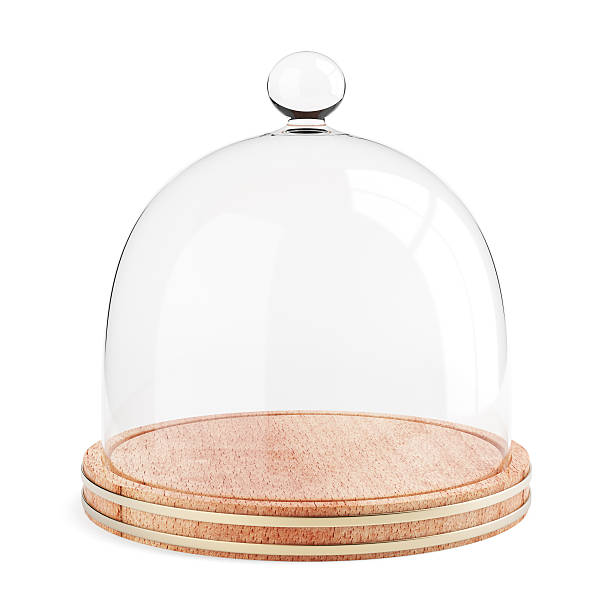 Glass dome on the wooden plate isolated on white background stock photo