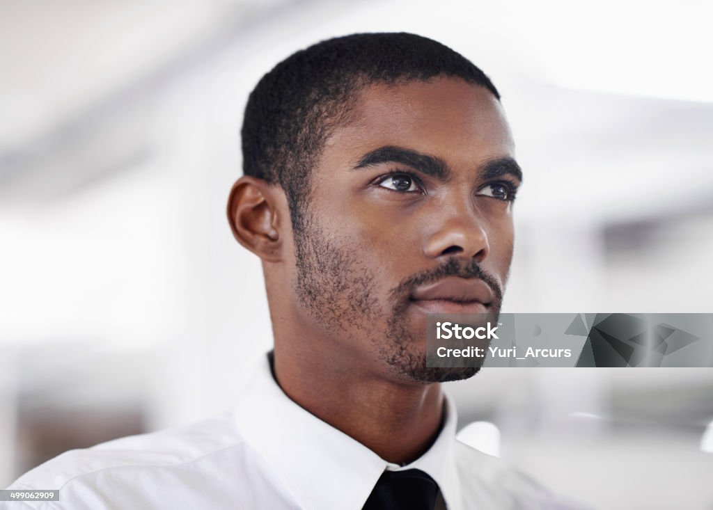 He was born ready Shot of a confident young businessman Looking Up Stock Photo