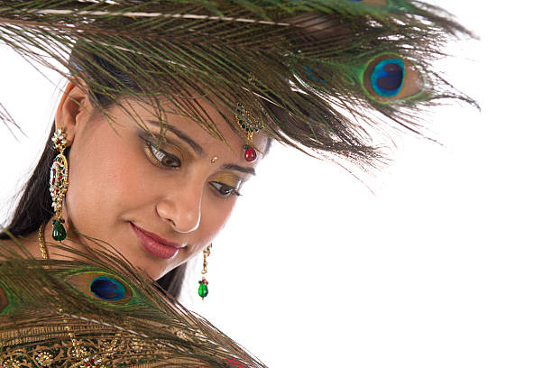 istock Indian female with peacock feathers. 499080521