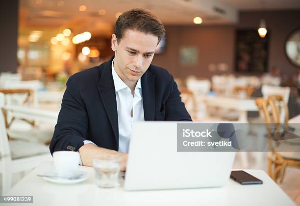 Man Working At Cafe Stock Photo - Download Image Now - 20-29 Years, Adult, Adults Only