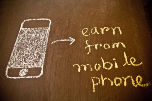 Smartphone and mobile banking concept on blackboard