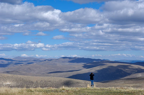 istock Teenage Boy Looking Out at Clouds and Hills 499081363