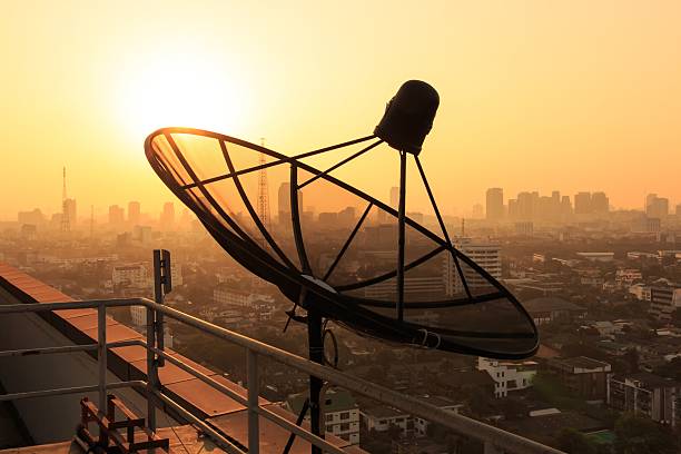 istock Satellite Dish on the Roof at Sunrise. 499083279