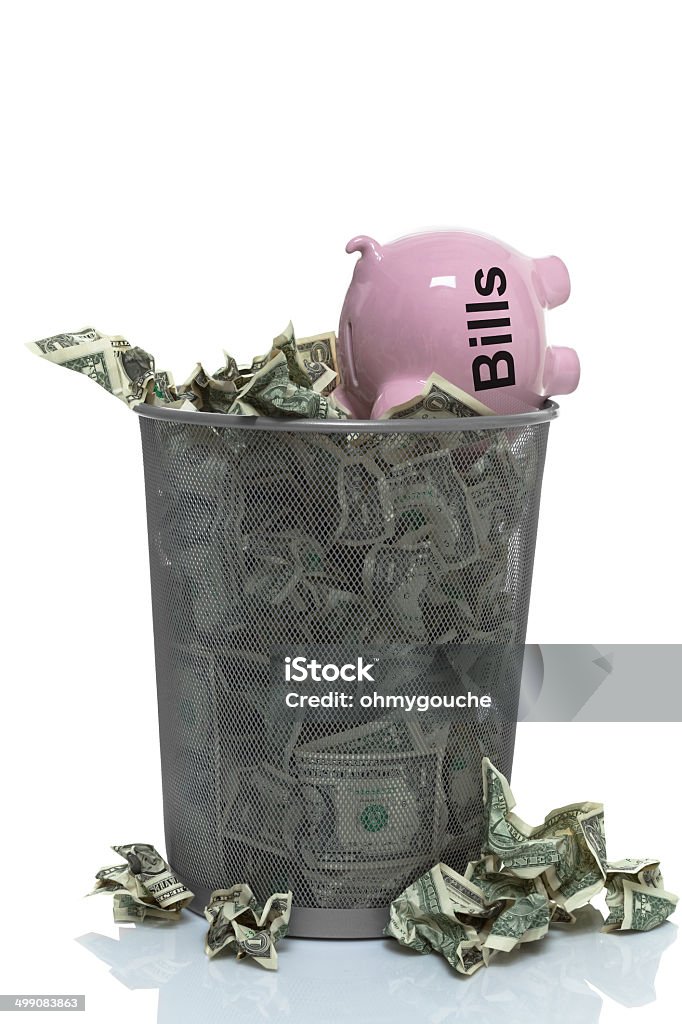 Throwing your money away on bills Basket Stock Photo