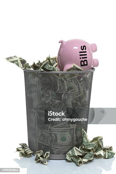 Throwing Your Money Away On Bills Stock Photo - Download Image Now - Basket, Business, Business Finance and Industry