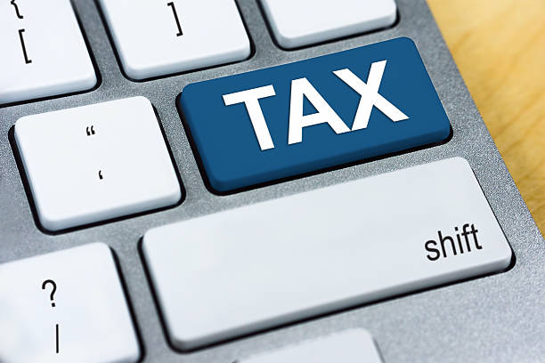 istock Written word TAX on blue keyboard button 499084430