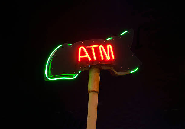 istock Neon ATM sign isloated on black background 499085204