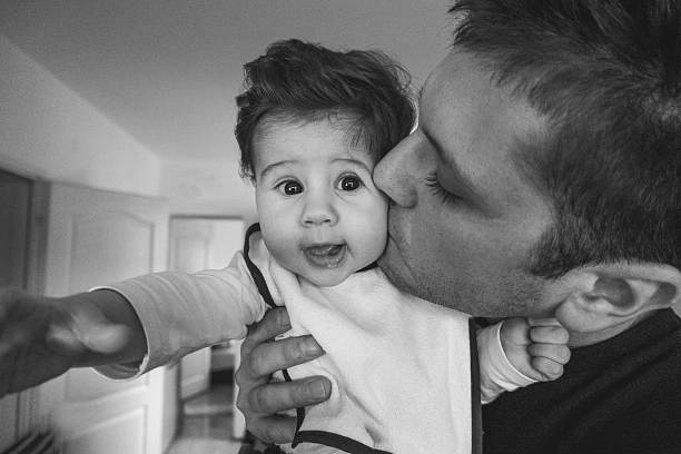 istock Father kissing his son 499086426