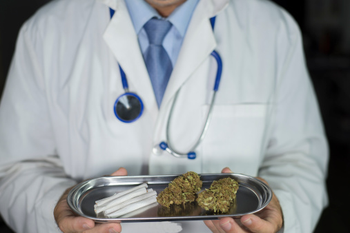 close up of Doctor holding medical marijuana