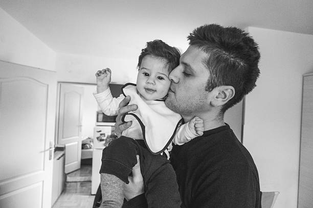istock Father kissing his son 499086784