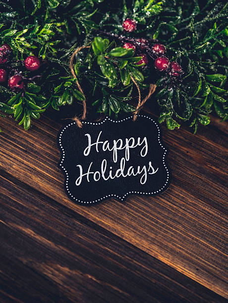 istock Happy Holidays gift tag with Christmas wreath and berries 499087080