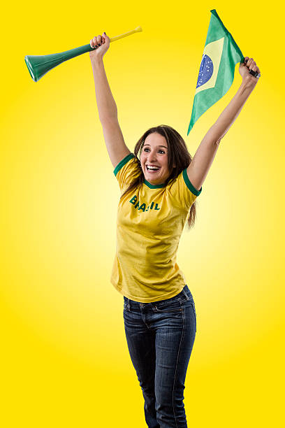 istock Female Brazilian fan celebrating 499087409