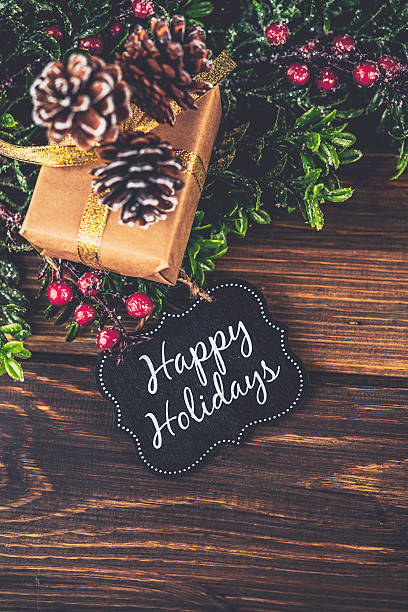 istock Rustic Christmas gift with Happy Holidays gift tag 499087782