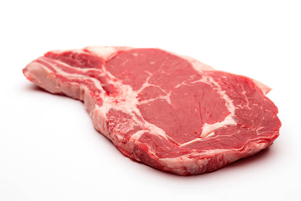 Rib eye on the bone Steak beef meat raw on white Rib eye on the bone Steak beef meat raw on white grass fed stock pictures, royalty-free photos & images