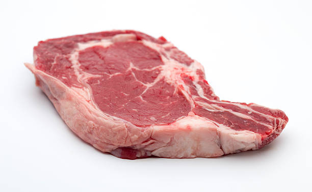istock Rib eye on the bone Steak beef meat raw on white 499089764