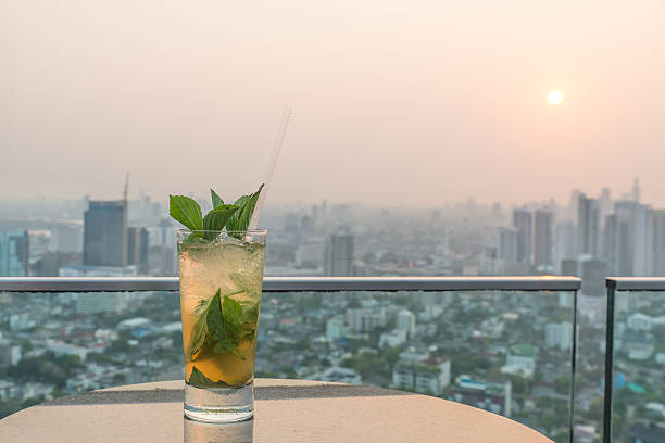 istock Mojito cocktail on table in rooftop bar 499090642