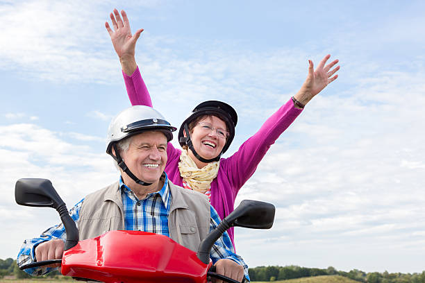 istock Happy Senior Couple Riding a Motor Scooter 499094028