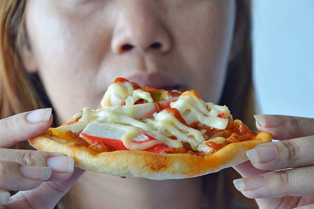 istock woman prepare to eating pizza 499094110
