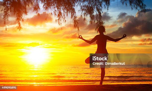 Silhouette Of Woman Meditating On The Beach Stock Photo - Download Image Now - Abstract, Activity, Adult