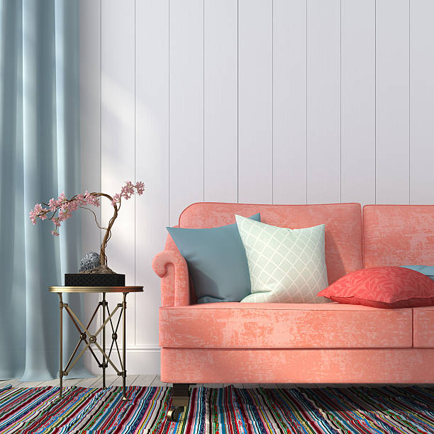 Salmon-colored sofa and a metal table