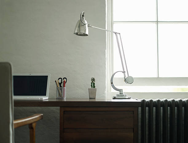 istock Study Desk With Laptop And Lamp 499096511