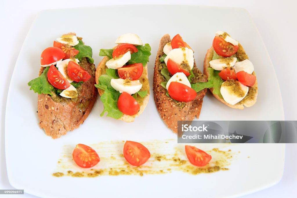 tapas with mozzarella and  cherry tomatoes Appetizer Stock Photo