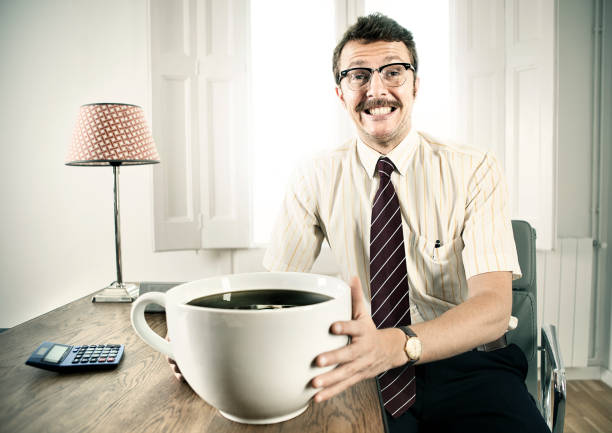 office worker with giant coffee - karikatuur stockfoto's en -beelden