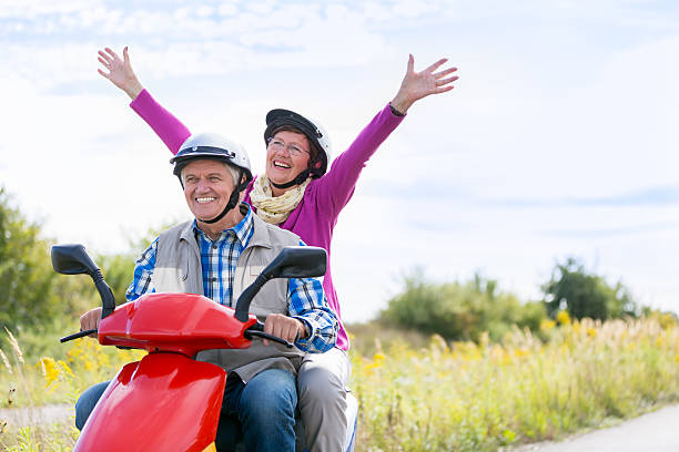 istock Happy Senior Couple Riding a Motor Scooter 499097330