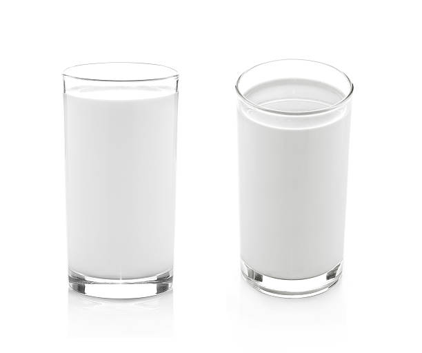 istock Glass of milk isolated on white 499097640