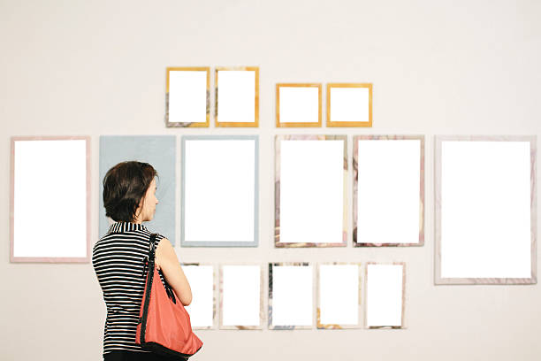istock Asian woman standing in an art gallery 499097885