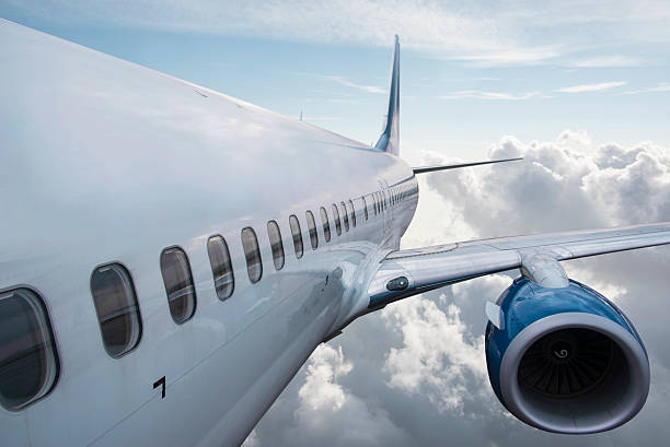 istock Body of an Airplane Flying Above Cloud 499098598
