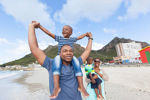 istock African family spending a day on the beach 499099359