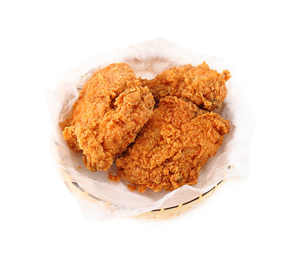 istock fried chicken in basket on white background 499099491