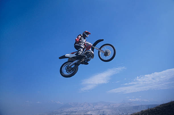 istock Mountain Biker Jumping Against Blue Sky 499108177