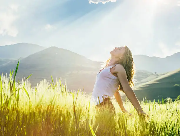 Photo of Young woman outdoor enjoying the sunlight