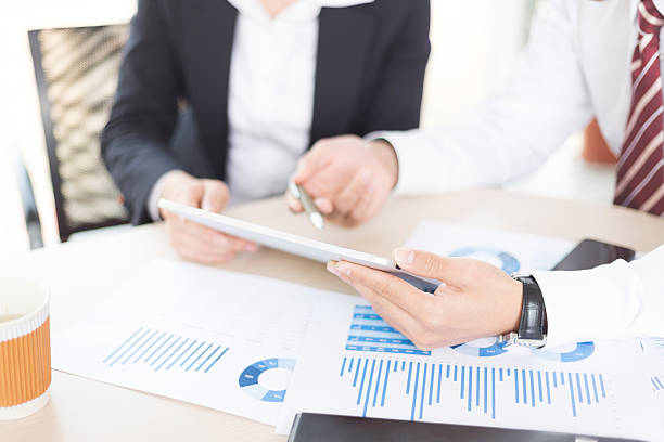 istock Modern people doing business, graphs and charts being demonstrat 499108881