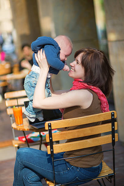 istock Happy young mother with her little son in a cafe 499110145
