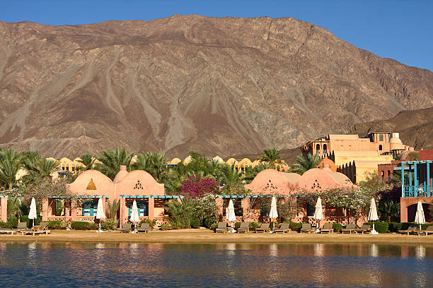 istock Luxury hotel buildings with their's reflection in water 499110333