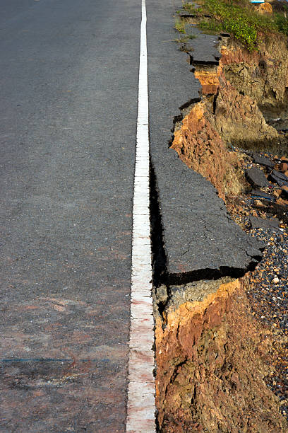 istock Side of the broken asphalt road collapsed and fallen 499111735