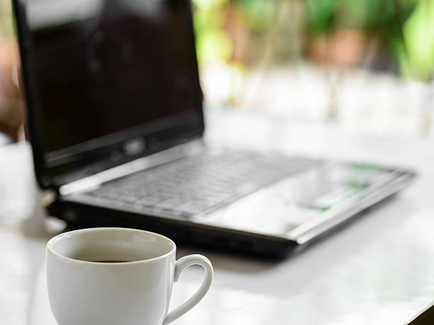 istock Coffee cup and laptop for business, Selective focus on coffee. 499111957