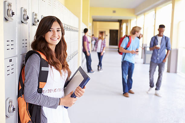 istock Female High School Student Standing By Lockers 499114057