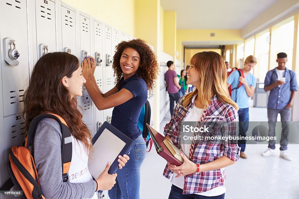 Group Of Female High School Students Talking By Lockers Group Of Female High School Students Talking By Lockers Smiling School Building Stock Photo