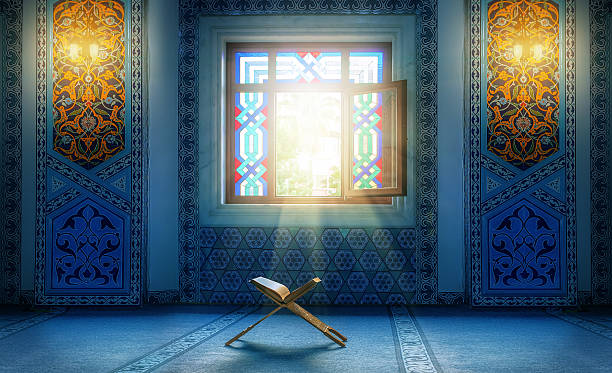 Koran - holy book of muslim. in Turkish mosque under the daylight from the window holy book stock pictures, royalty-free photos & images