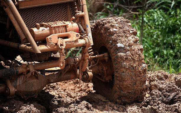 car tires and winch in dirt road car tires and winch in dirt road.background. cable winch stock pictures, royalty-free photos & images