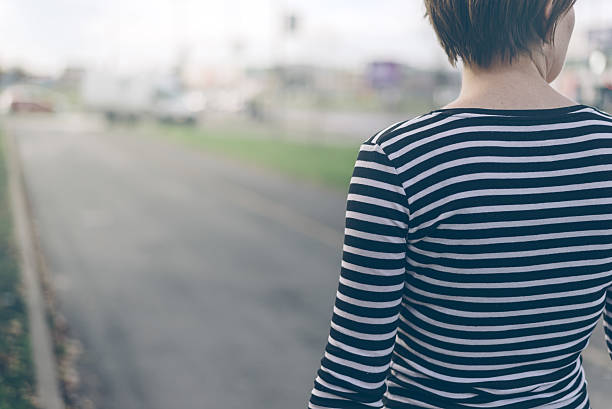 istock Ordinary woman walking down the street 499119008