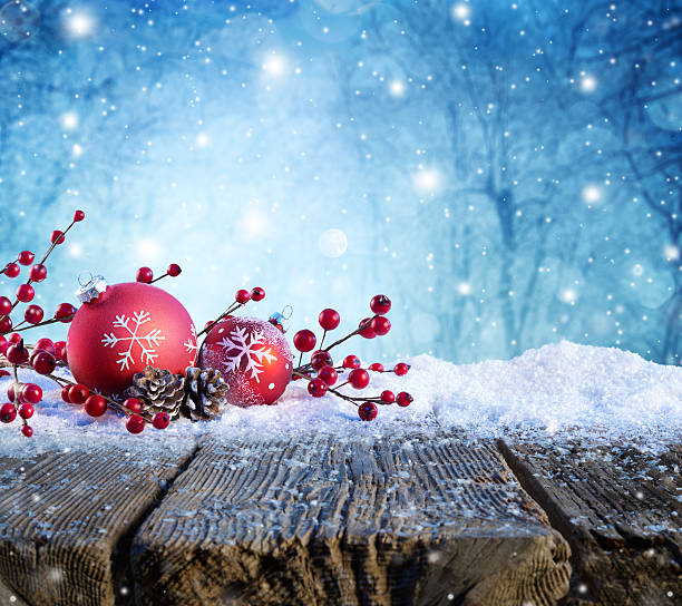 istock Red Christmas Ornament On Snowy Table With Snowfall On Background 499119648
