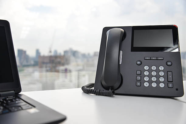 istock Laptop and IP Phone 499120640
